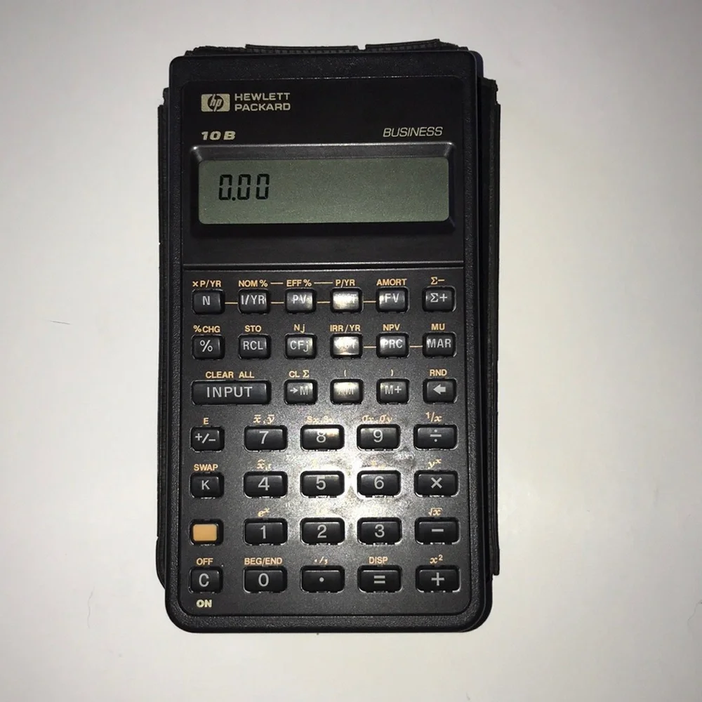 Vintage Hewlett-Packard 10b Business calculator with manual